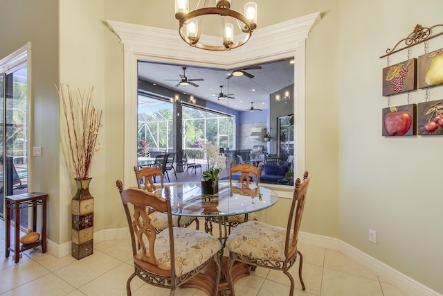 tiled dining area with ceiling fan with notable chandelier