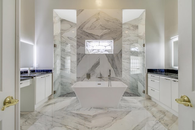 bathroom featuring vanity and separate shower and tub