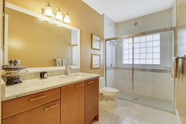 bathroom featuring ornamental molding, vanity, tile patterned flooring, toilet, and a shower with shower door