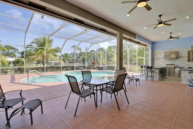 view of patio / terrace featuring an outdoor kitchen, a lanai, and exterior bar