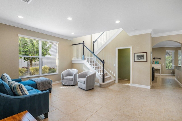 living room with light tile patterned flooring and ornamental molding