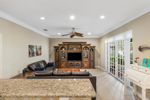 tiled living room with french doors, ceiling fan, and ornamental molding