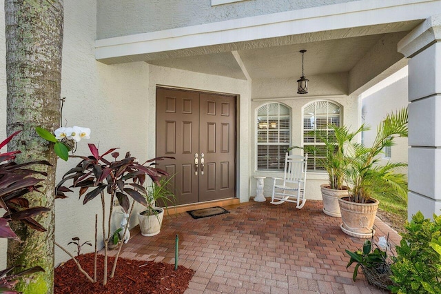 doorway to property with covered porch