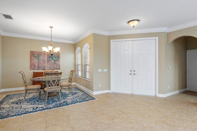 dining space with a notable chandelier, light tile patterned floors, and crown molding