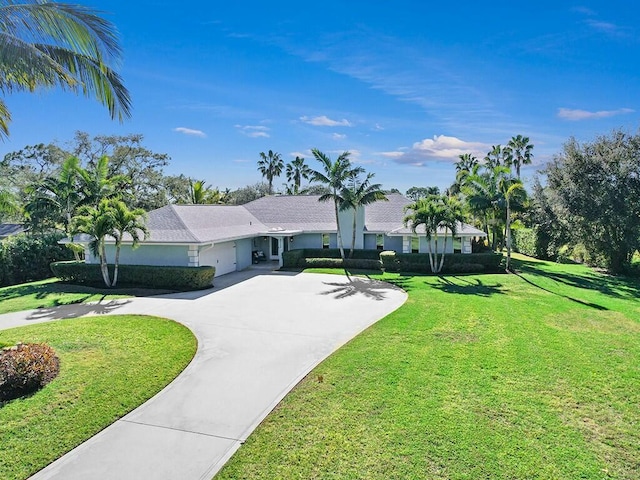 ranch-style home featuring a front lawn