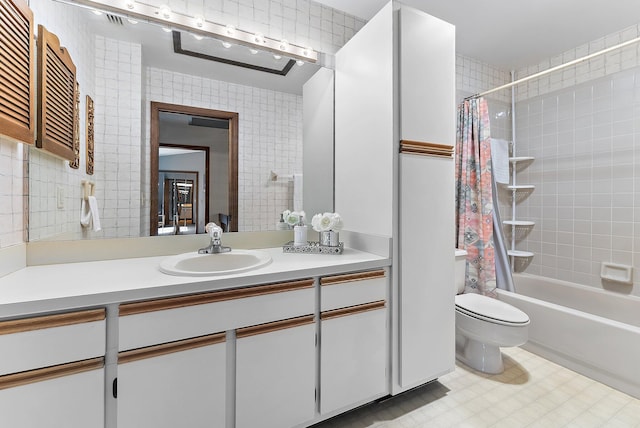 bathroom featuring toilet, shower / bath combination with curtain, and vanity