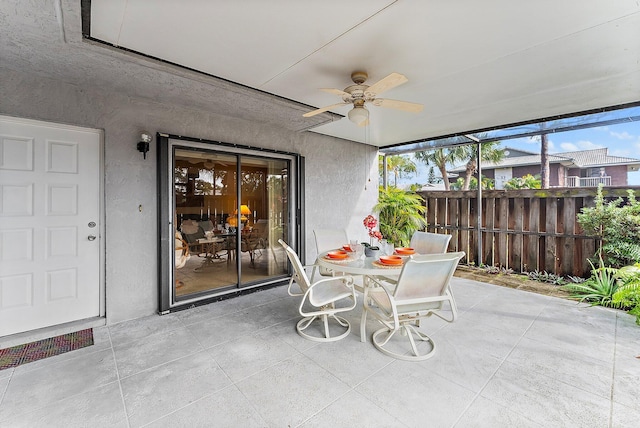 sunroom with a ceiling fan