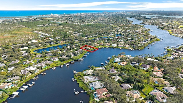 aerial view featuring a residential view and a water view