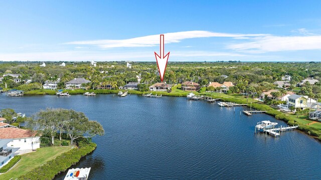 birds eye view of property with a water view and a residential view