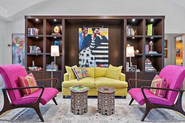 living area featuring lofted ceiling