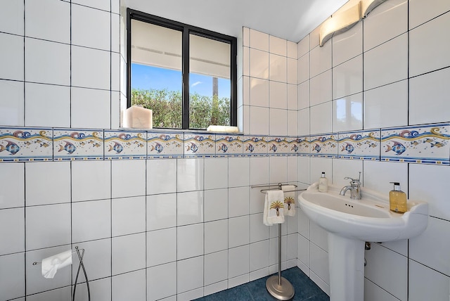 bathroom with tile walls