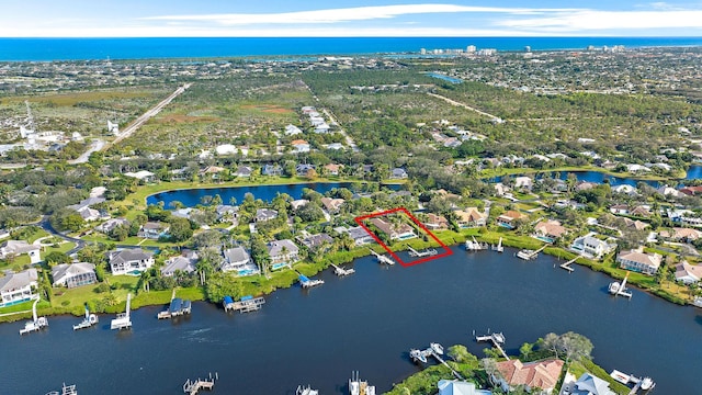 aerial view featuring a water view and a residential view