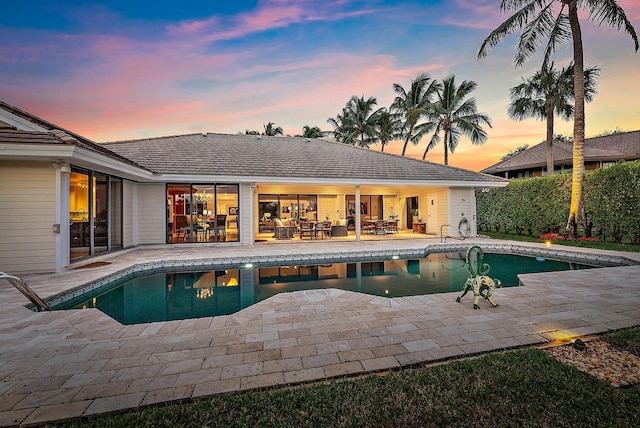 view of swimming pool featuring a fenced in pool and a patio