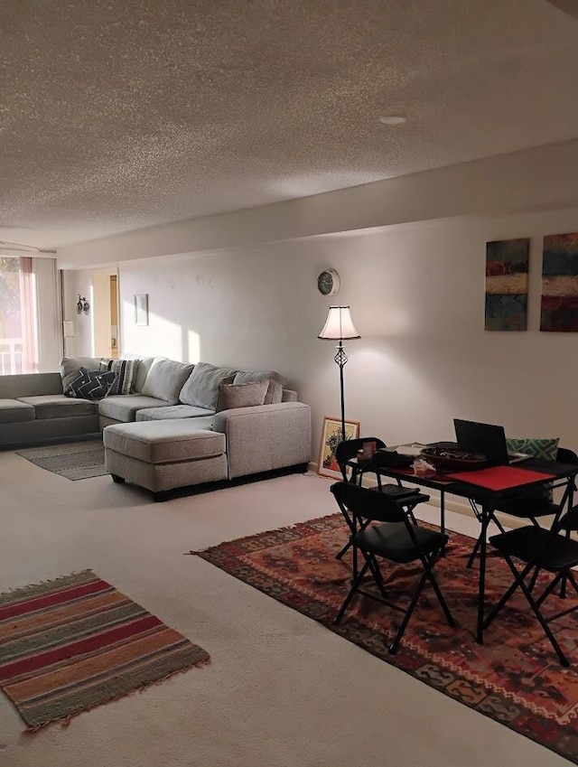 carpeted living room with a textured ceiling