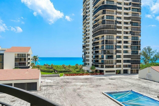 view of swimming pool with a water view