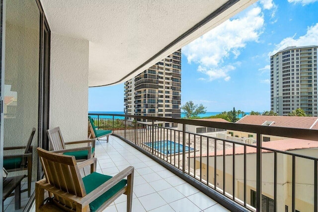 balcony featuring a water view