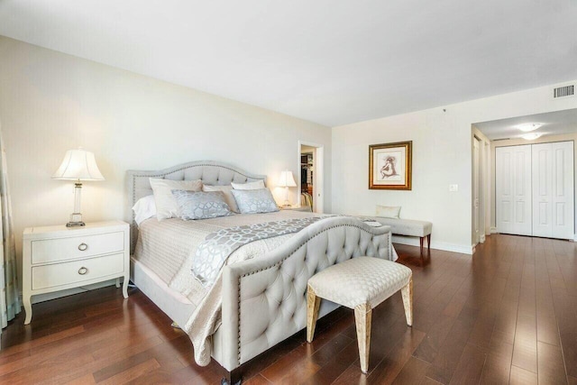 bedroom with a closet and dark wood-type flooring