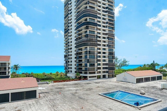 view of swimming pool featuring a water view