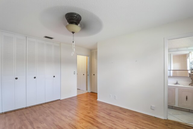 unfurnished room with ceiling fan and hardwood / wood-style floors