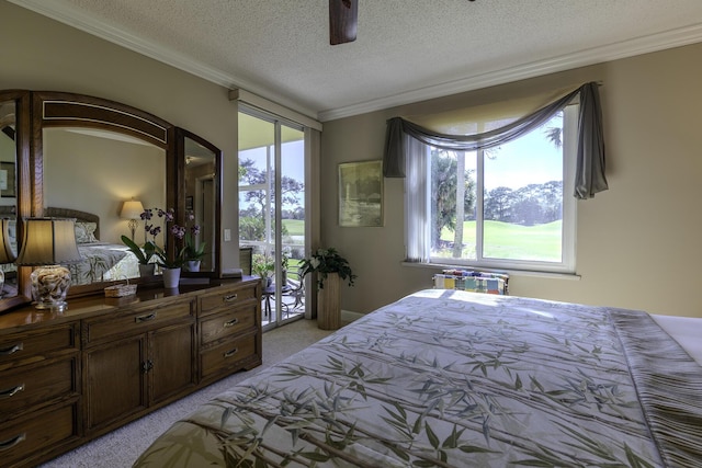 carpeted bedroom with access to exterior, a textured ceiling, ceiling fan, and crown molding