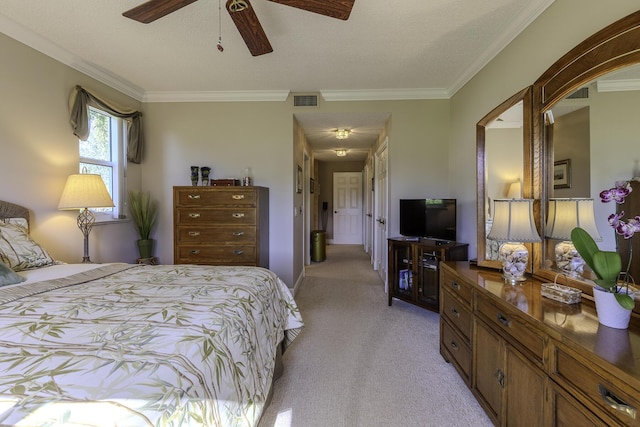 bedroom featuring ceiling fan, light colored carpet, and crown molding