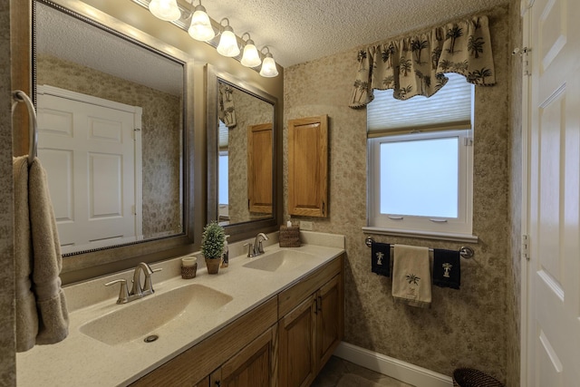 bathroom featuring vanity and a textured ceiling