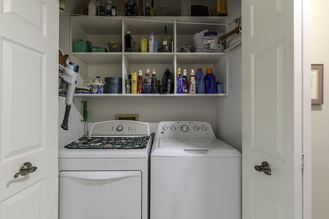 clothes washing area featuring washing machine and dryer