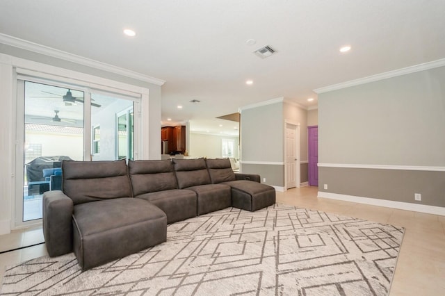 living room featuring ceiling fan, light tile patterned floors, and ornamental molding