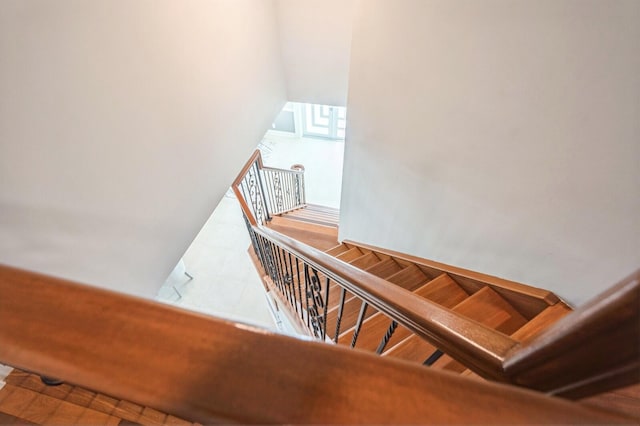 stairs with vaulted ceiling