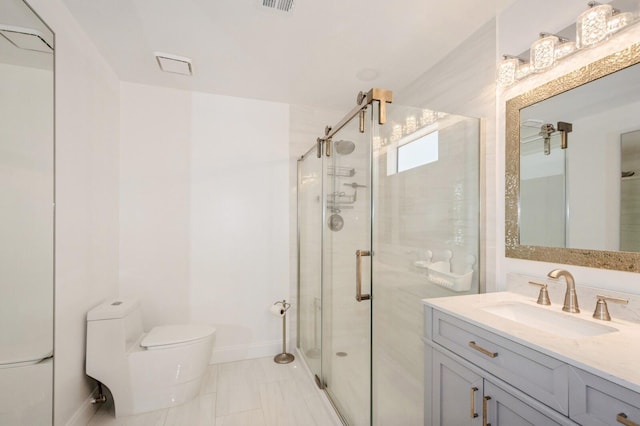 bathroom featuring vanity, toilet, and walk in shower