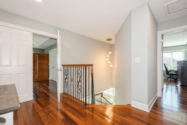 corridor featuring dark hardwood / wood-style flooring