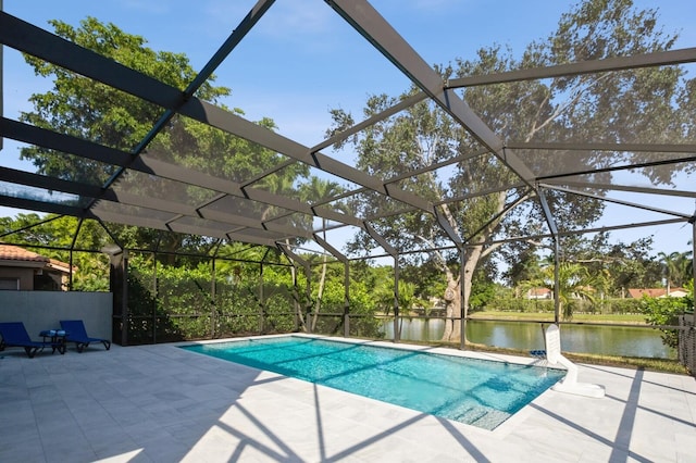 view of pool featuring a lanai, a patio area, and a water view