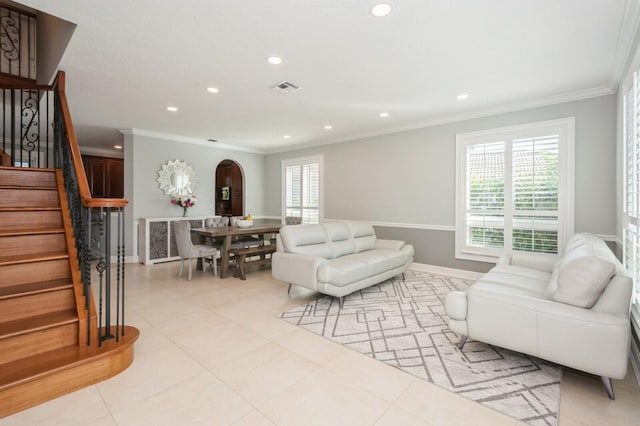 tiled living room featuring crown molding