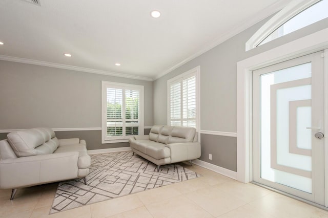 living room featuring ornamental molding and light tile patterned floors