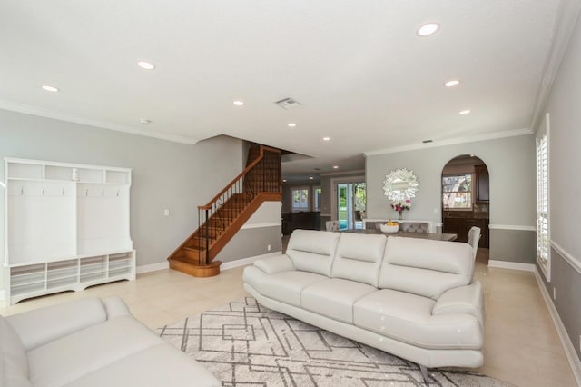 tiled living room featuring ornamental molding