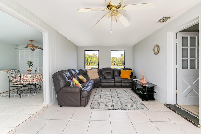 tiled living room with ceiling fan