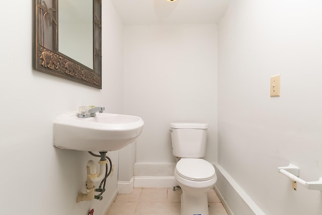 bathroom with tile patterned flooring and toilet