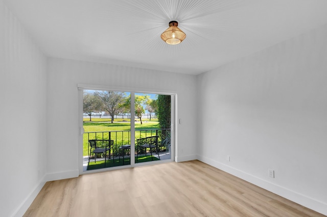 empty room with light hardwood / wood-style floors