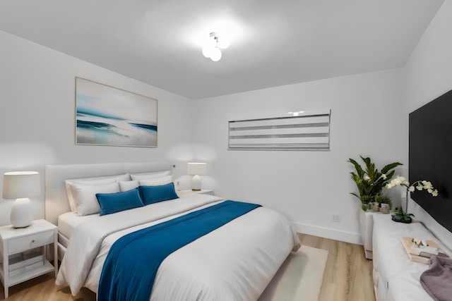 bedroom with light wood-type flooring