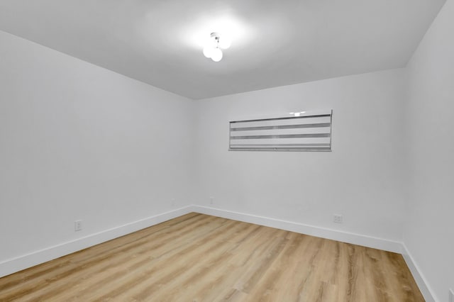 unfurnished room with light wood-type flooring