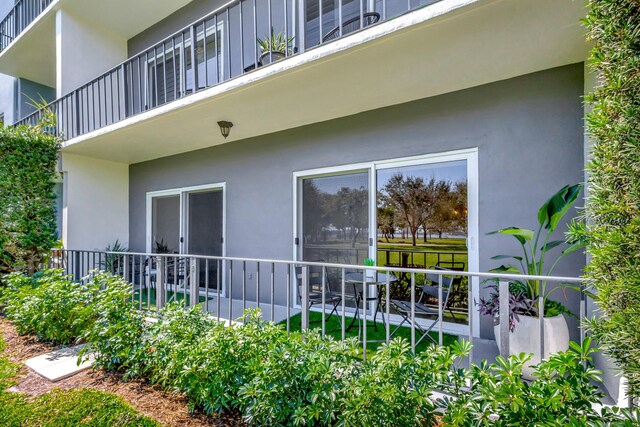 view of home's exterior with a balcony