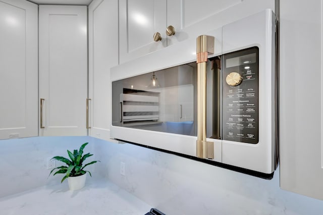 interior details featuring white cabinetry