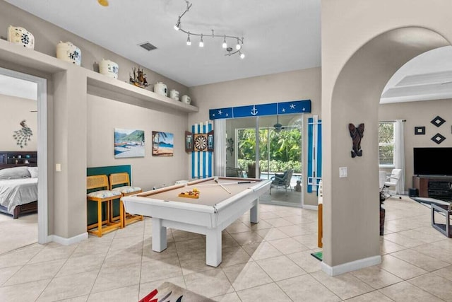 game room with a wealth of natural light, light tile patterned flooring, and billiards