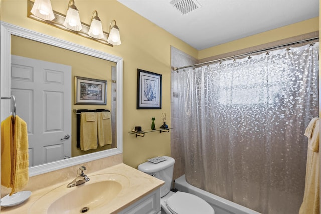 full bathroom with vanity, shower / bath combo, and toilet