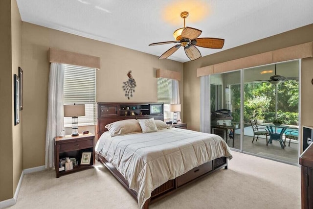 bedroom with access to outside, ceiling fan, and light carpet