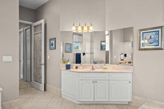 bathroom with tile patterned flooring and vanity