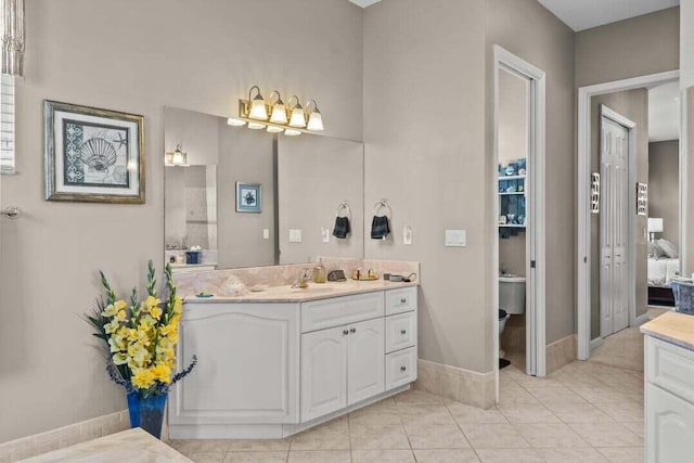 bathroom with vanity and tile patterned floors