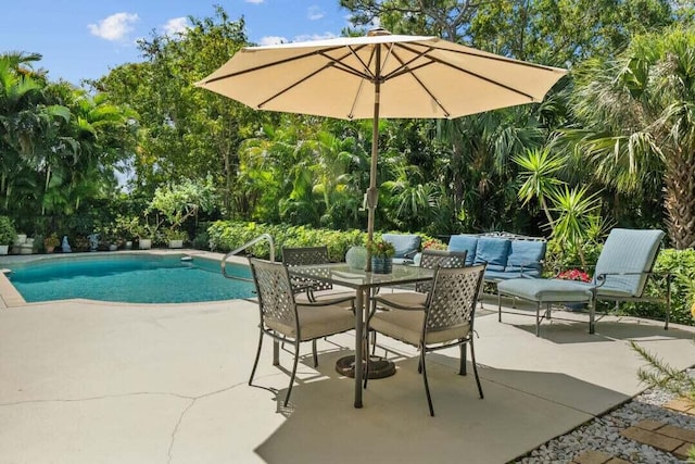 view of swimming pool featuring an outdoor living space and a patio