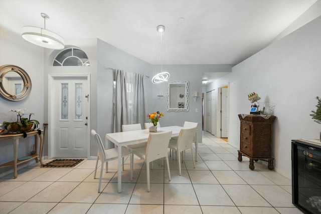 tiled dining space featuring wine cooler