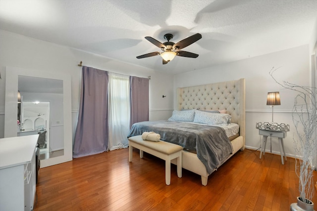 bedroom with ceiling fan and wood-type flooring